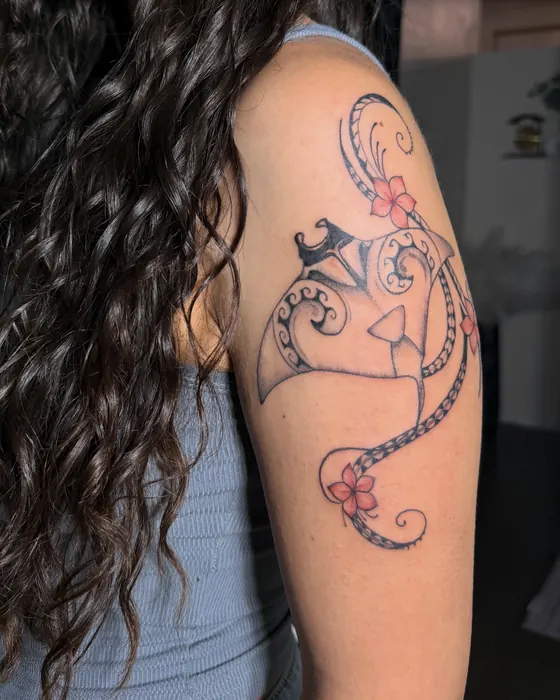 Chamorro tribal shoulder tattoo with red hibiscus flowers