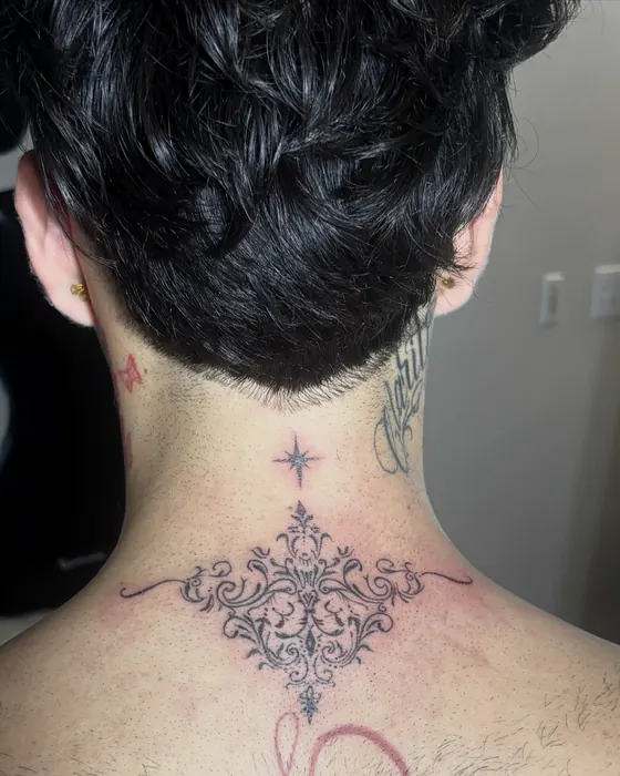 Ornamental filigree at the base of the neck